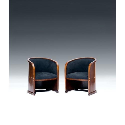 TWO ARMCHAIRS so-called BARREL CHAIRS